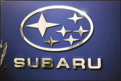 Subaru badge sign on the office wall