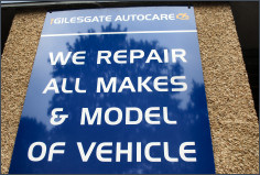 Our sign reading We repair all makes and model of vehicle